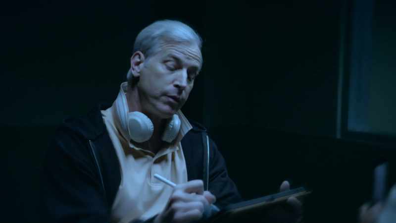 Charles wore a black hoodie