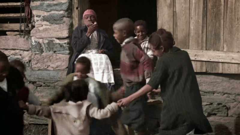 [CHILDREN SINGING]