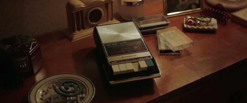 [choral music playing on tape]