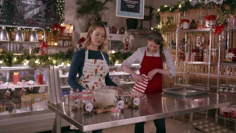 [Christmas music playing]