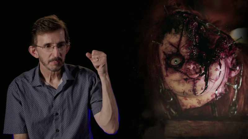 Chucky sticks his arm into her throat