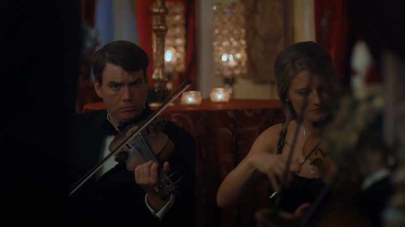 [classical music plays] **