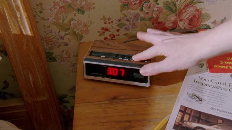 [ clock radio blaring song]