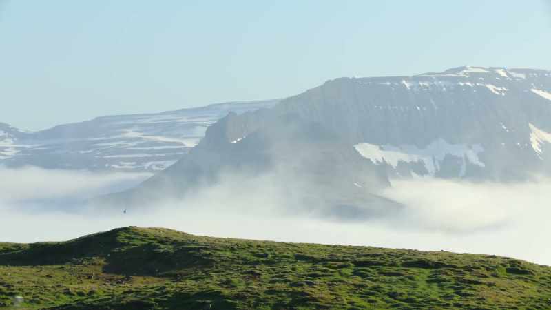 Close to the Arctic Circle, it's topped by glaciers