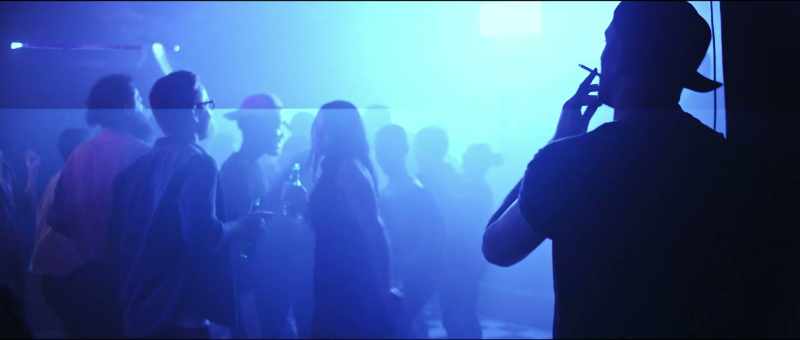 [Club music playing]