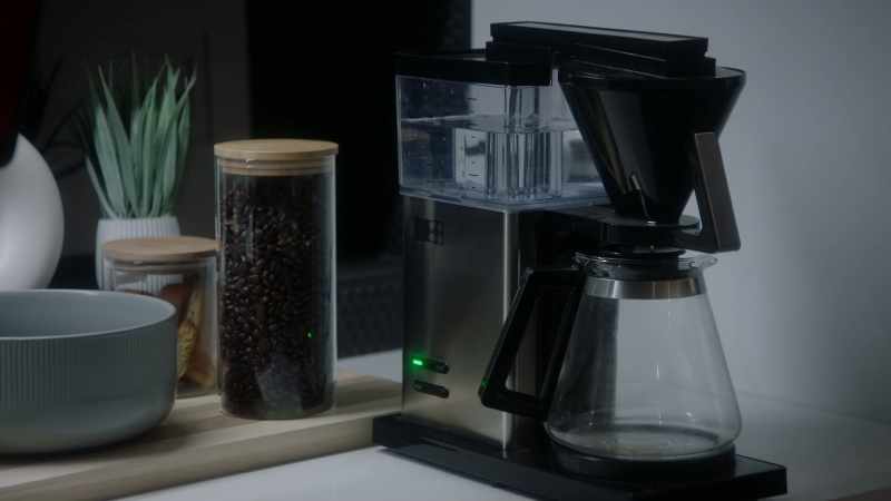 (coffee maker beeps, water burbles)