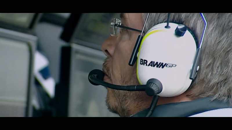 [commentator] Button finishes his lap