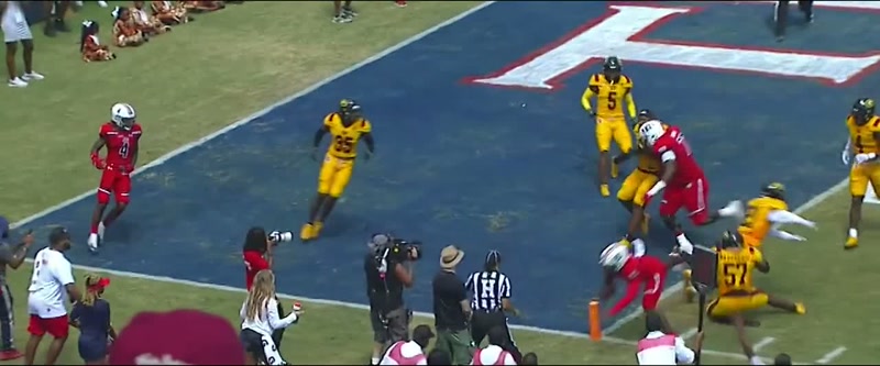 [commentator] Shedeur Sanders has time... Tries to get to the end zone!