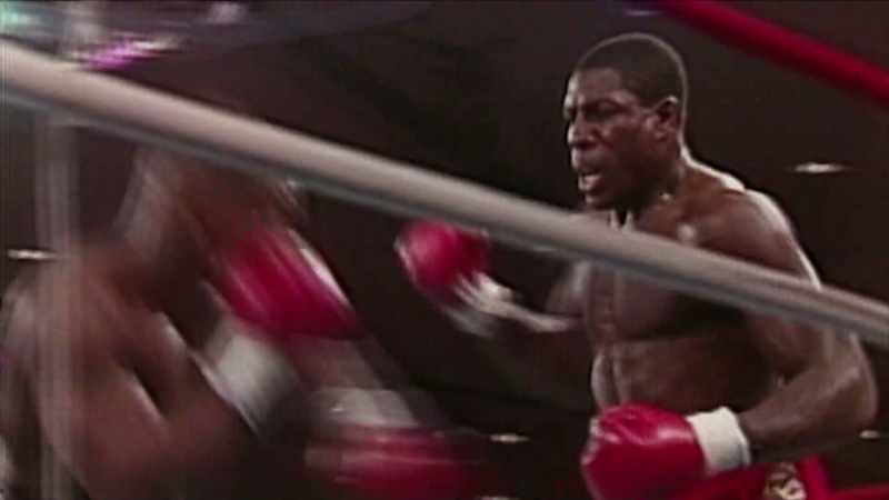 [Commentator] Tyson gets down with a left hook