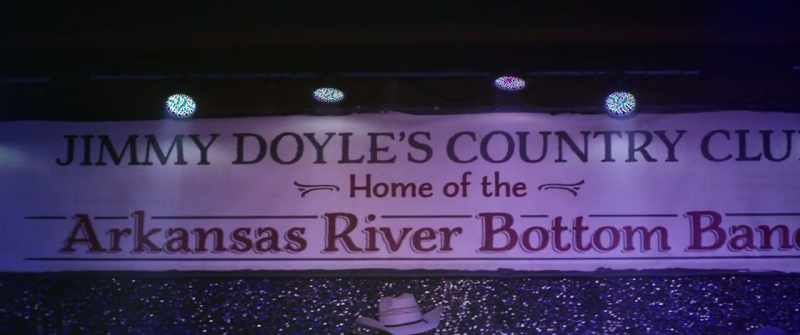 [country music playing]