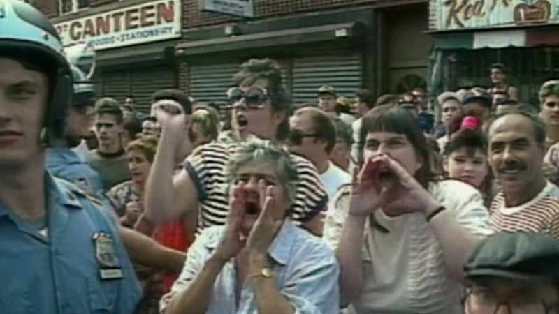 [crowd clamoring]
