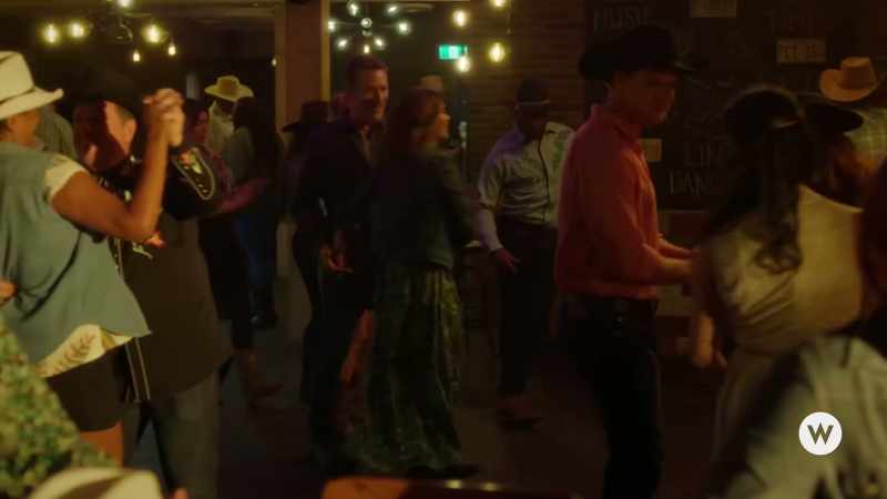 [dance music playing]
