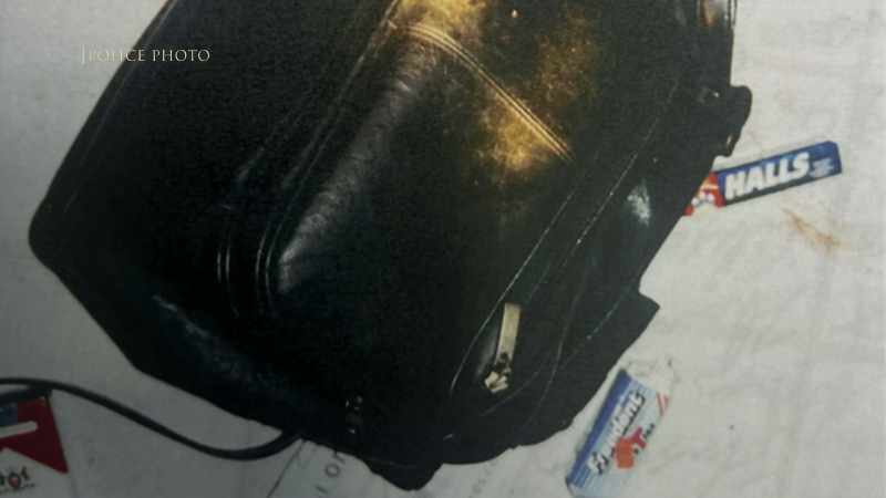 Debbie's purse has been cut out from underneath her