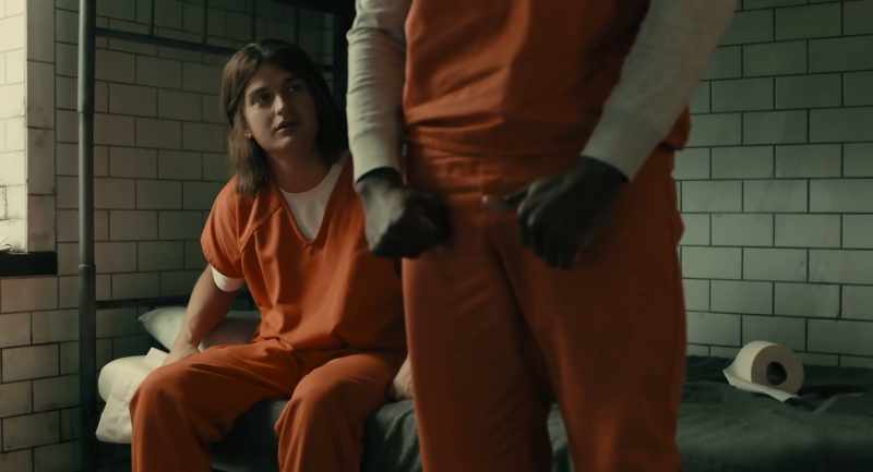 (deep tense music) (inmates chatter quietly)