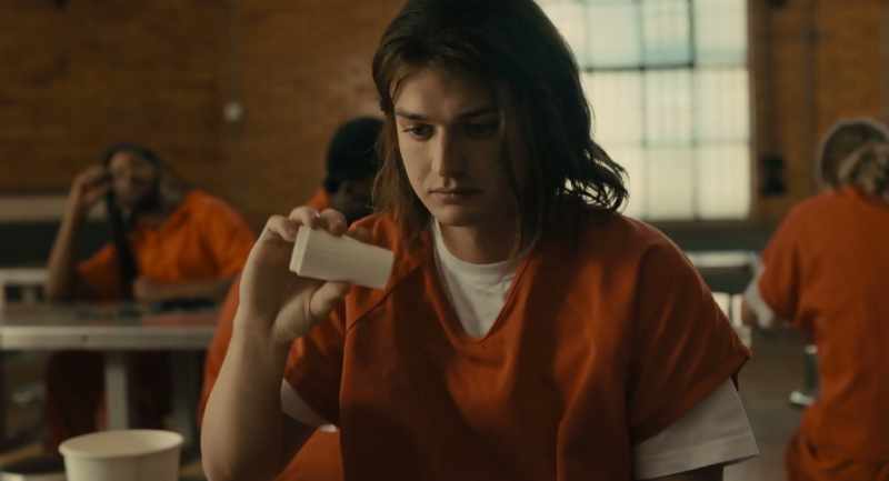 (deep tense music) (inmates chatter quietly)