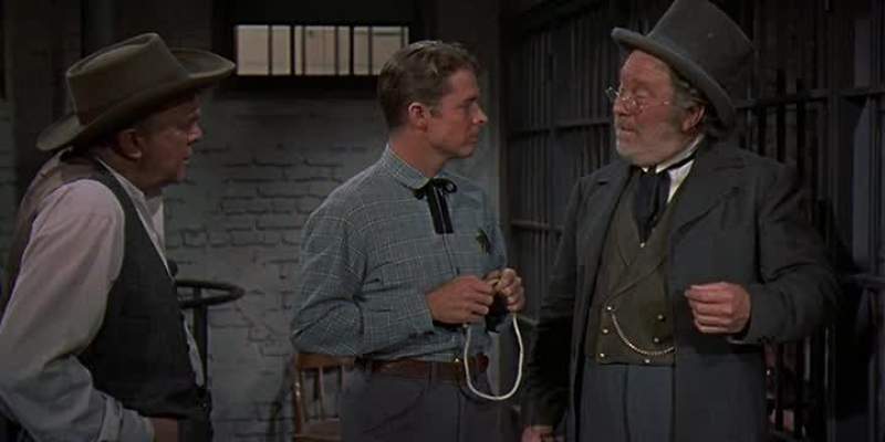 Deliver the prisoner at 10 o'clock Decker's Saloon