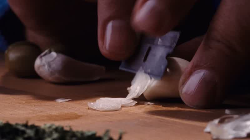 IN PRISON DINNER WAS ALWAYS A BIG THINGWE HAD A PASTA COURSE AND THEN WE HAD MEAT OR FISHPAULIE DID THE PREP WORKHE WAS DOING A YEAR FOR CONTEMPTAND HE HAD THIS WONDERFUL SYSTEM FOR DOING THE GARLICHE