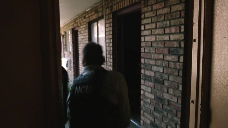 Directly across the courtyard, up the stairs