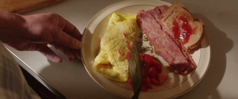 Don't let the omelet touch the fruit. She likes a separation