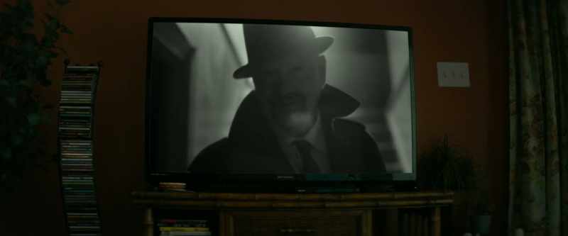 [dramatic music on TV]