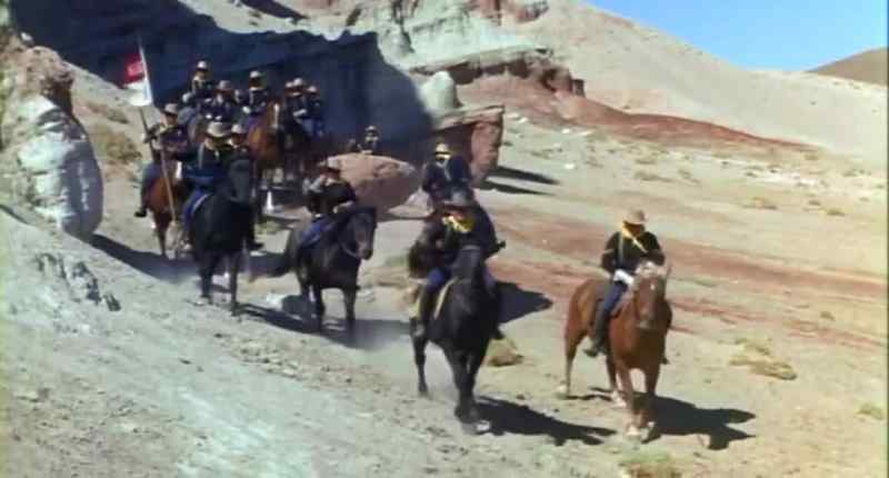 (dramatic orchestral music) (Apaches howl)