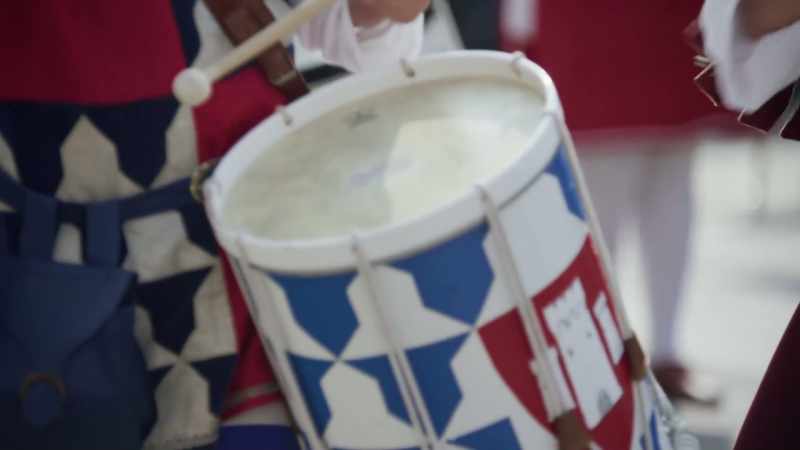 (drumming) -(street chatter)