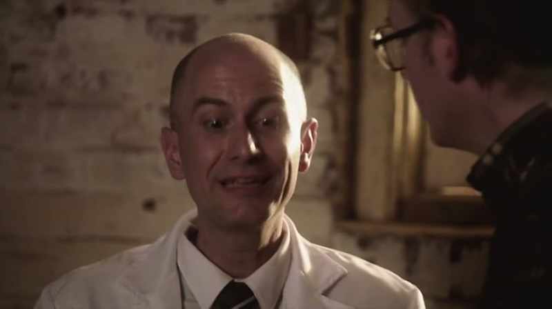 Earl Bakken listens to Lillehei's problem