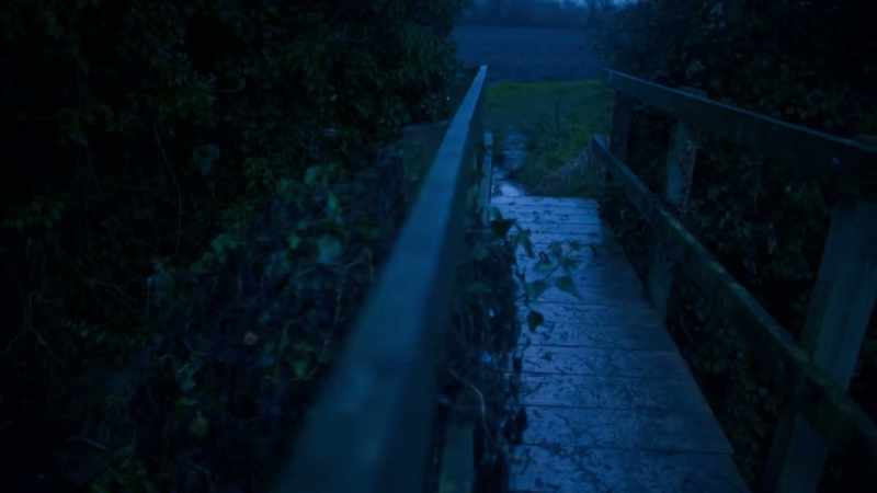 [eerie music playing]