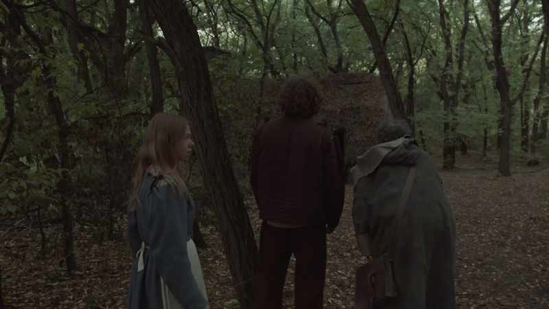 [eerie music] [voices whispering]