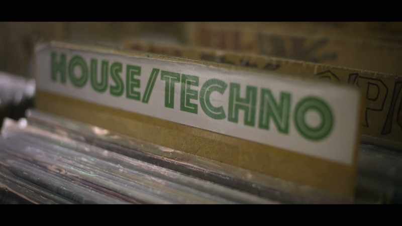 [electronic music playing]