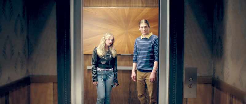 [ Elevator bell dings ]