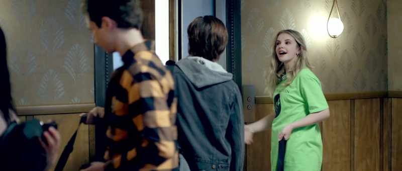[ Elevator bell dings ]