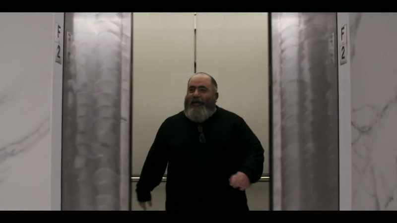 [elevator bell dings]