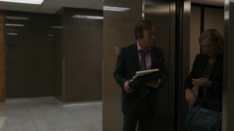 [ELEVATOR BELL DINGS]