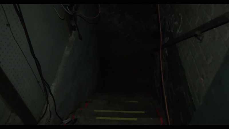 Entering the basement. [static crackling]