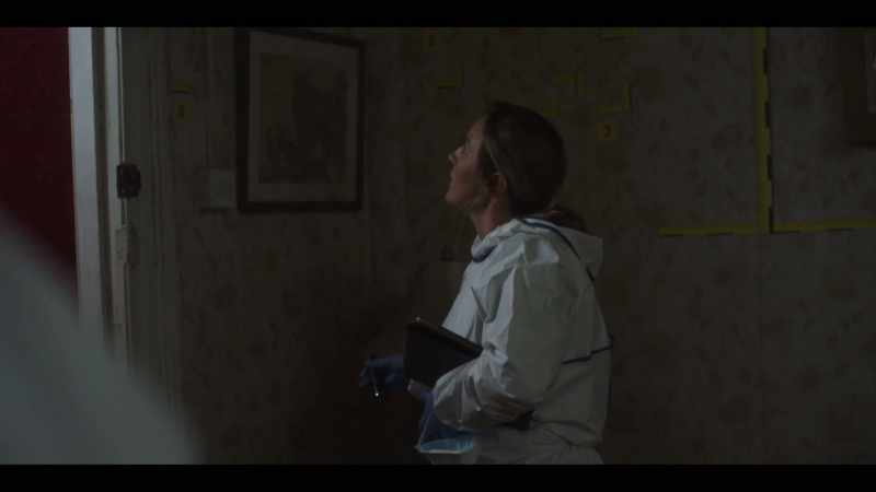 Esme is standing close to the wall and the door here, right?