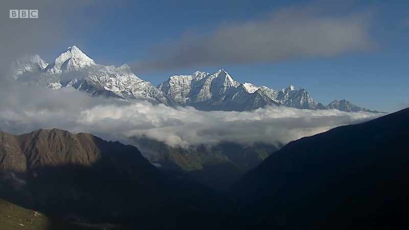 even the slopes of its highest mountains
