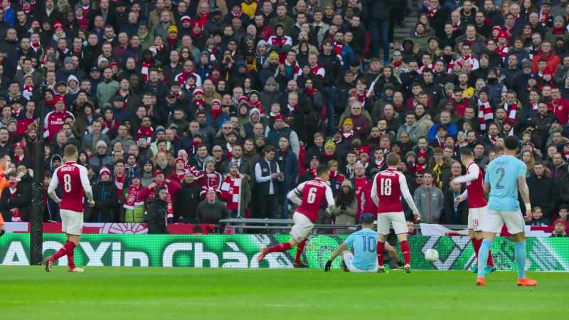 Eventually gets the right-footed shot away