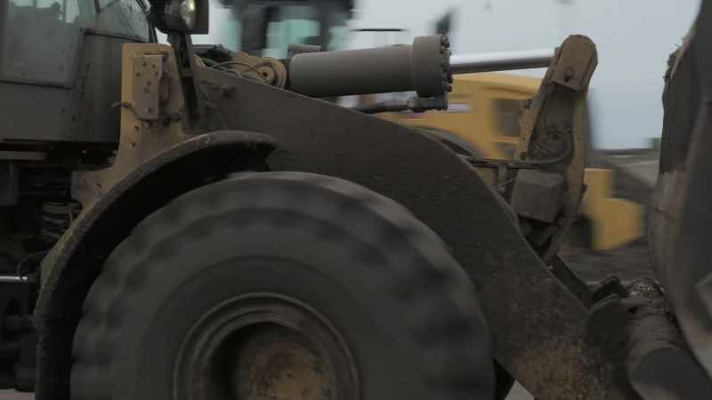 [excavator rumbling]
