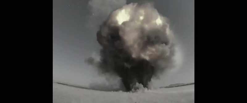 [explosion booming]