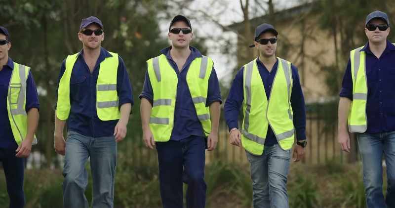 Fifteen look-alike workers arrive on cue