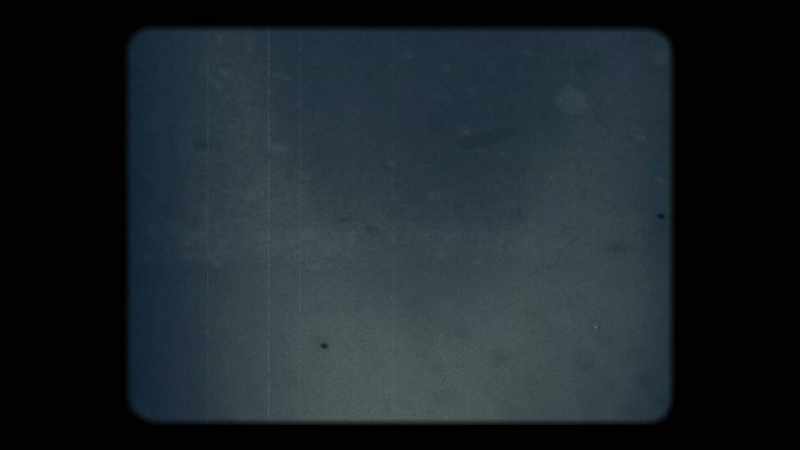 [Film reel buzzing]