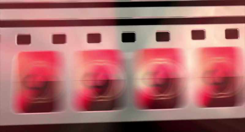(film reel flapping) (dramatic music)