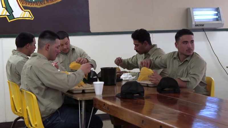 (fire camp crew conversing)