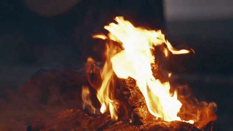 (fire crackling) (ominous music continues)
