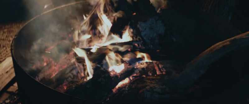 [fire crackling]