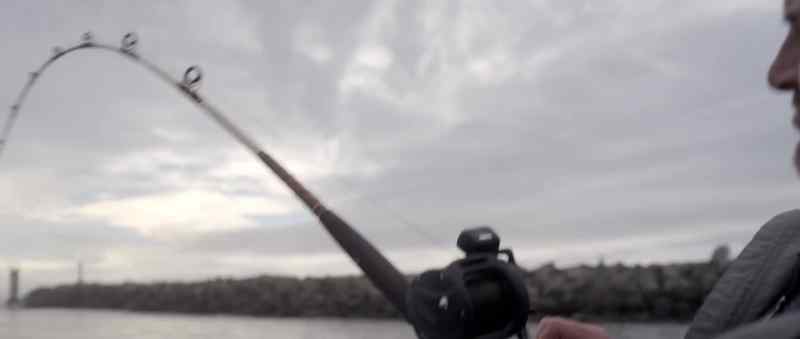 (fishing line whips) (music continues)