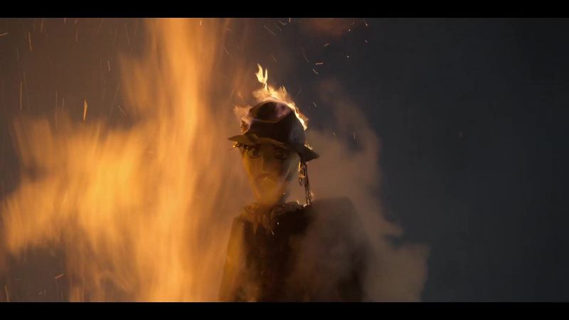 [flames crackling]