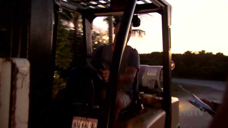 (forklift rumbling)
