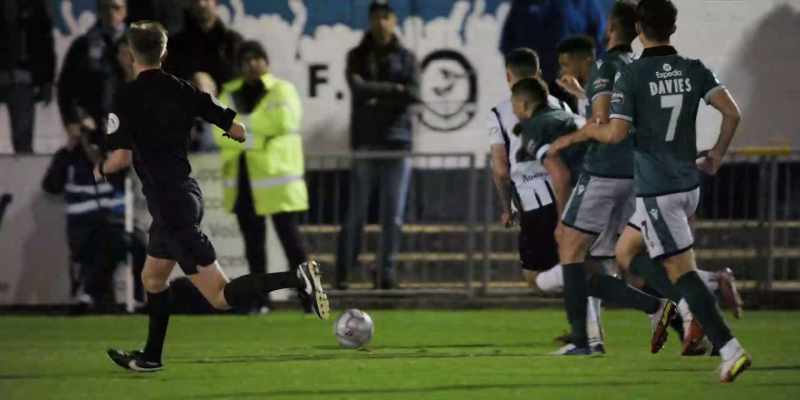 Forward touch, and Brisley tries to clear